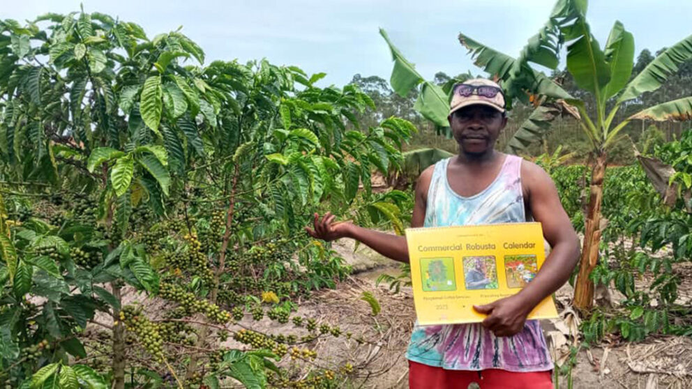 Coffee farmer Hakim holds his robusta calendar